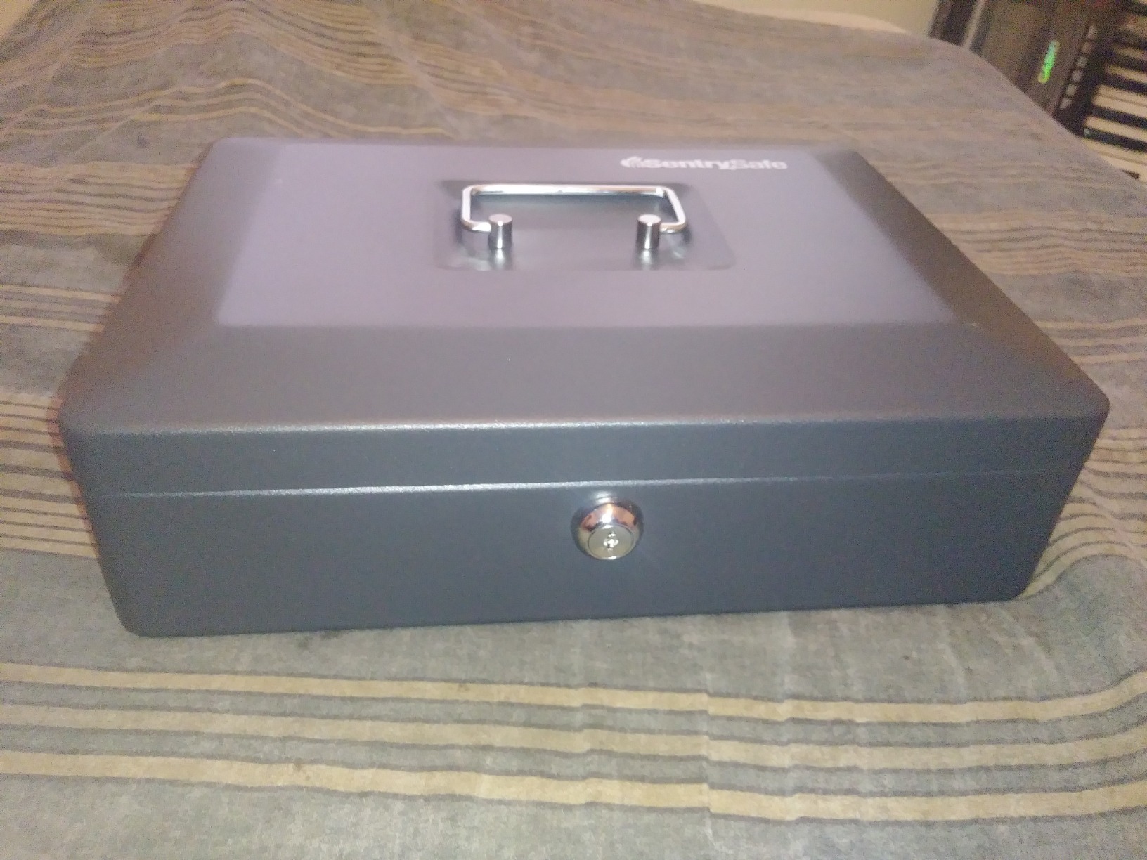 SentrySafe Black Money Saving Box with Cash Tray and Key Lock, Portable Safe Box with Carrying Handle, 0.21 Cubic Feet, 3.75 x 12 x 9.3 Inches, CB-12 customer photo 1