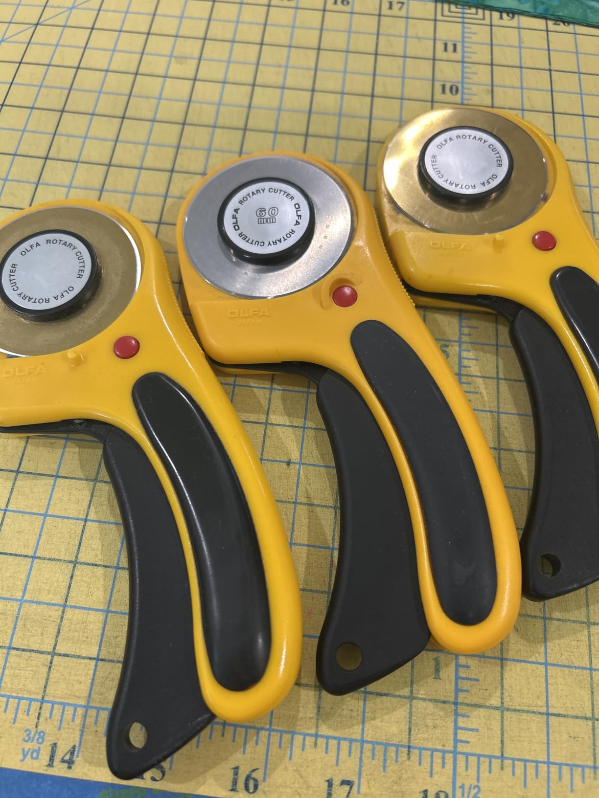 OLFA 60mm Ergonomic Squeeze-Handle Rotary Cutter (RTY-3/DX) - 12-Layer | 60mm endurance tungsten steel, squeeze trigger auto-retract - Heavy-duty fabric cutting - Quilters and Crafters customer photo 1