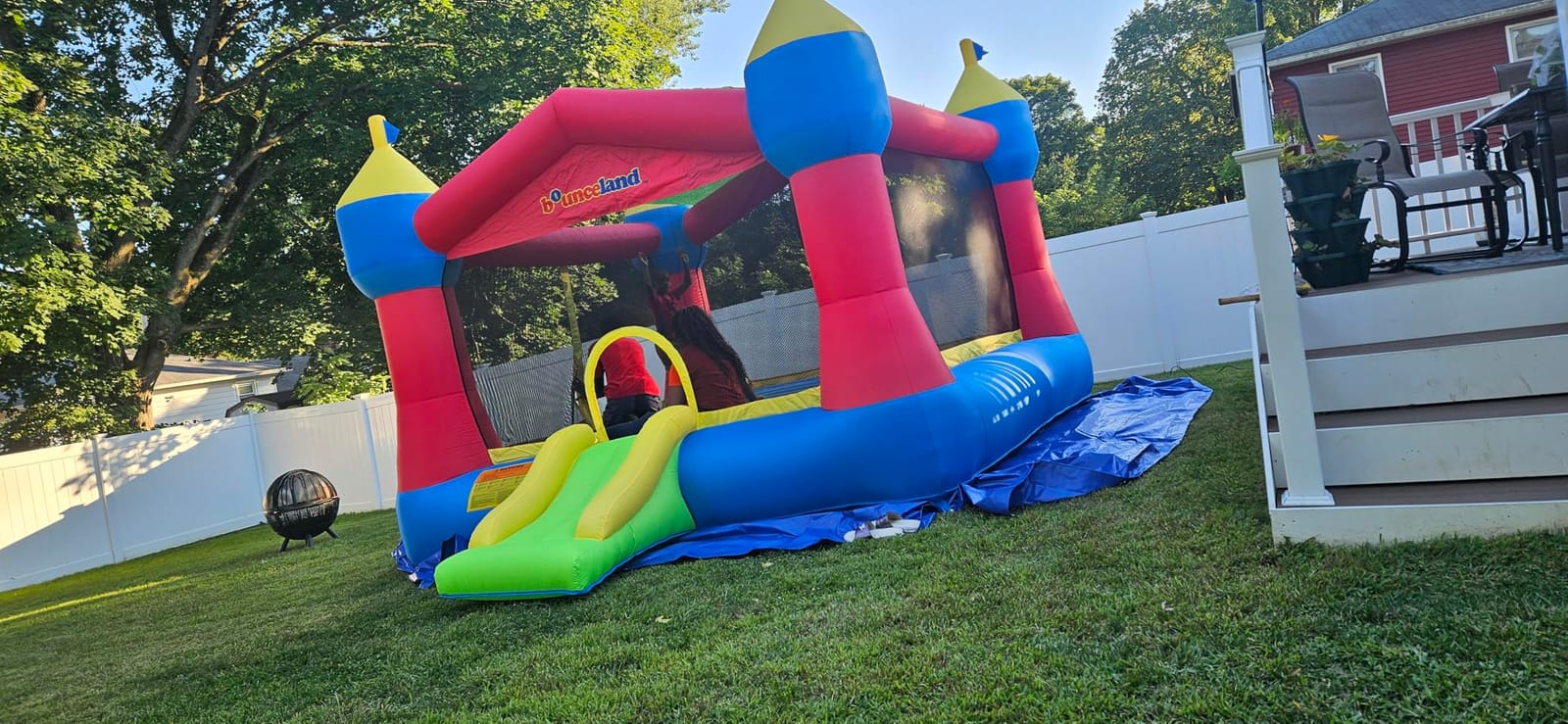 Bounceland Inflatable Party Castle Bounce House Bouncer, 16 ft L x 13 ft W x 10.3 ft H, Basketball Hoop, Removable Sun Roof, UL Strong Blower included, Fun Slide and Bounce Area, Castle Theme for Kids customer photo 2