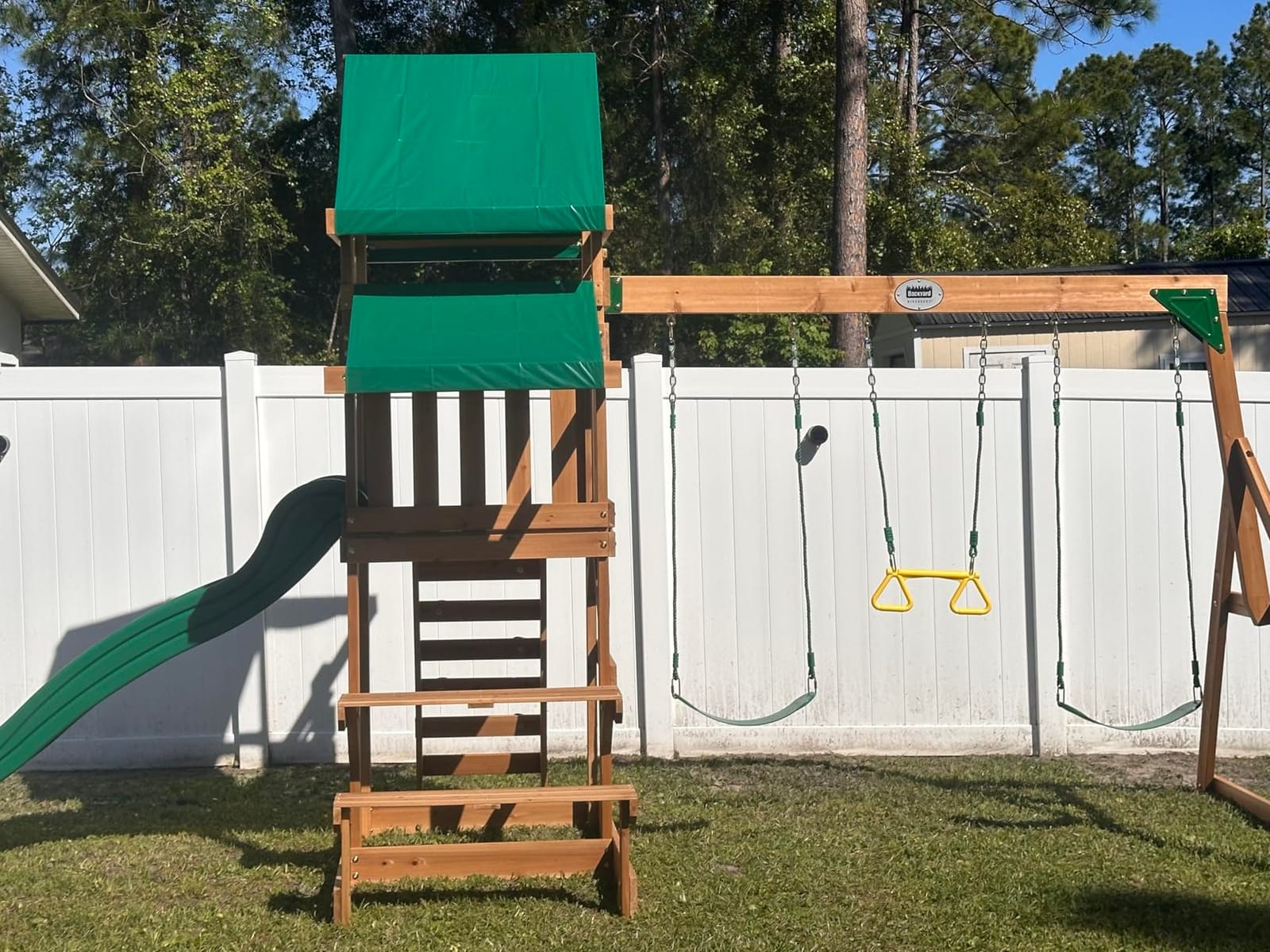 Backyard Discovery Beach Front Cedar Wood Swing Set with Wave Slide, Play Deck, Monkey Bars, Rock Wall Ladder, Shaded Picnic Area, Snack Bar customer photo 1