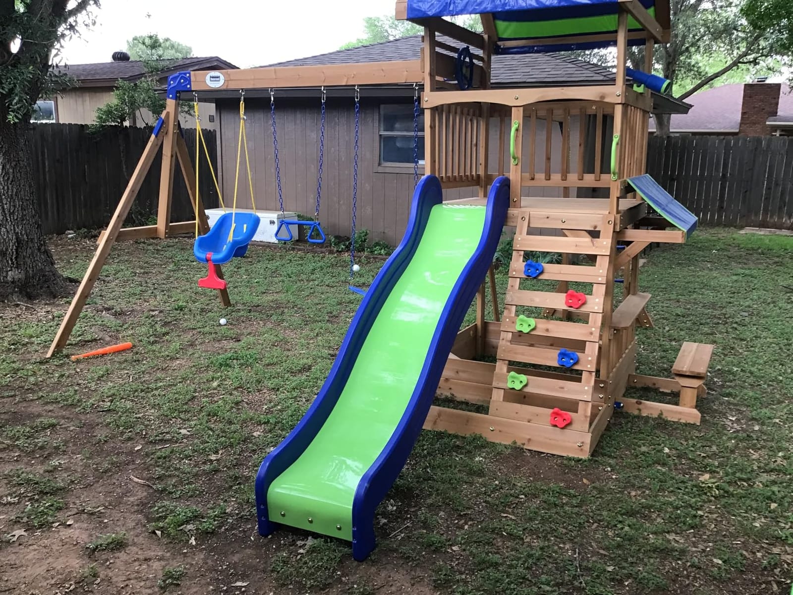Backyard Discovery Beach Front Cedar Wood Swing Set with Wave Slide, Play Deck, Monkey Bars, Rock Wall Ladder, Shaded Picnic Area, Snack Bar customer photo 2