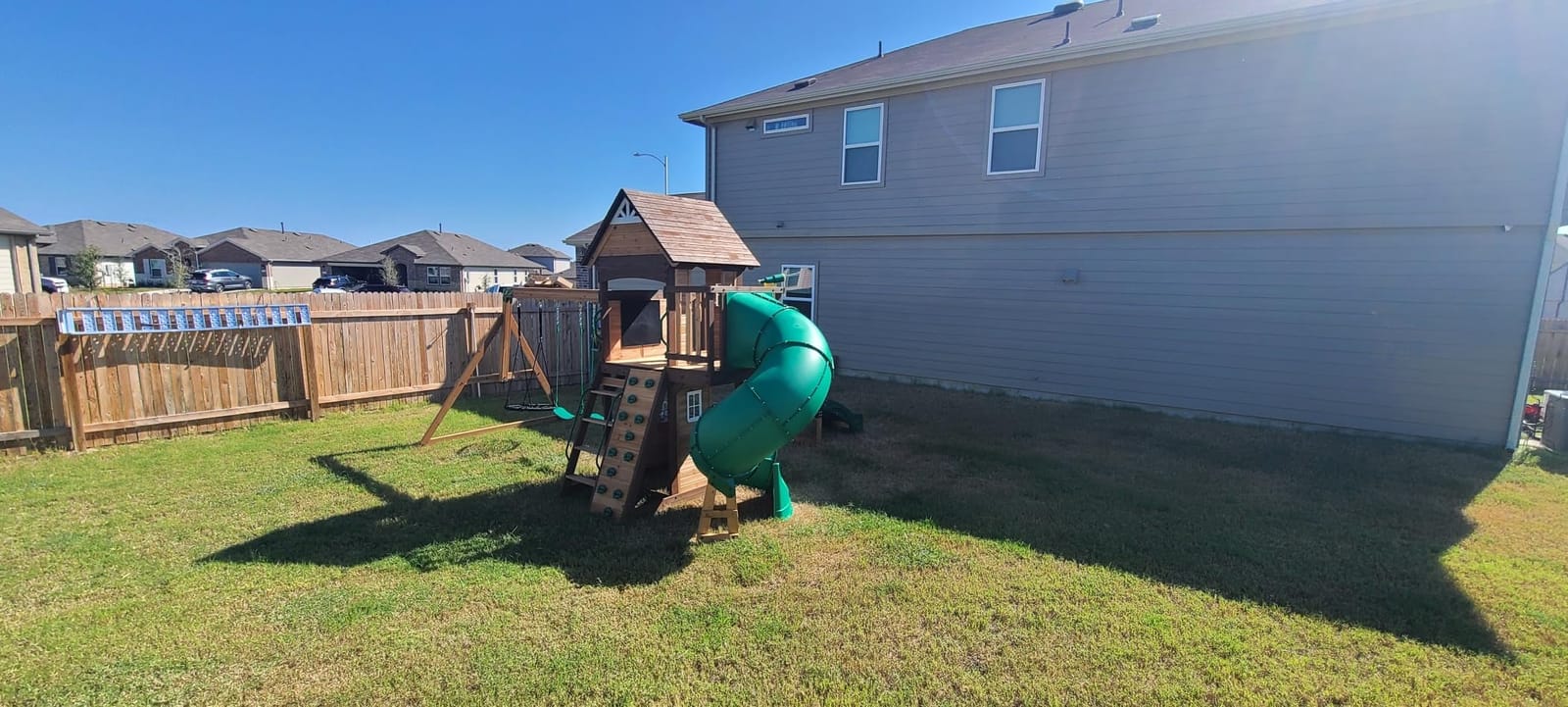 Backyard Discovery Cedar Cove Cedar Wood Swing Set with Spiral Tube Slide, Wave Slide, Clubhouse, Toy Grill, Snack Bar, Rock Wall, Belt Swings, Web Swing, Balcony, Chalkboard, Ladder, Outdoor Playset customer photo 1
