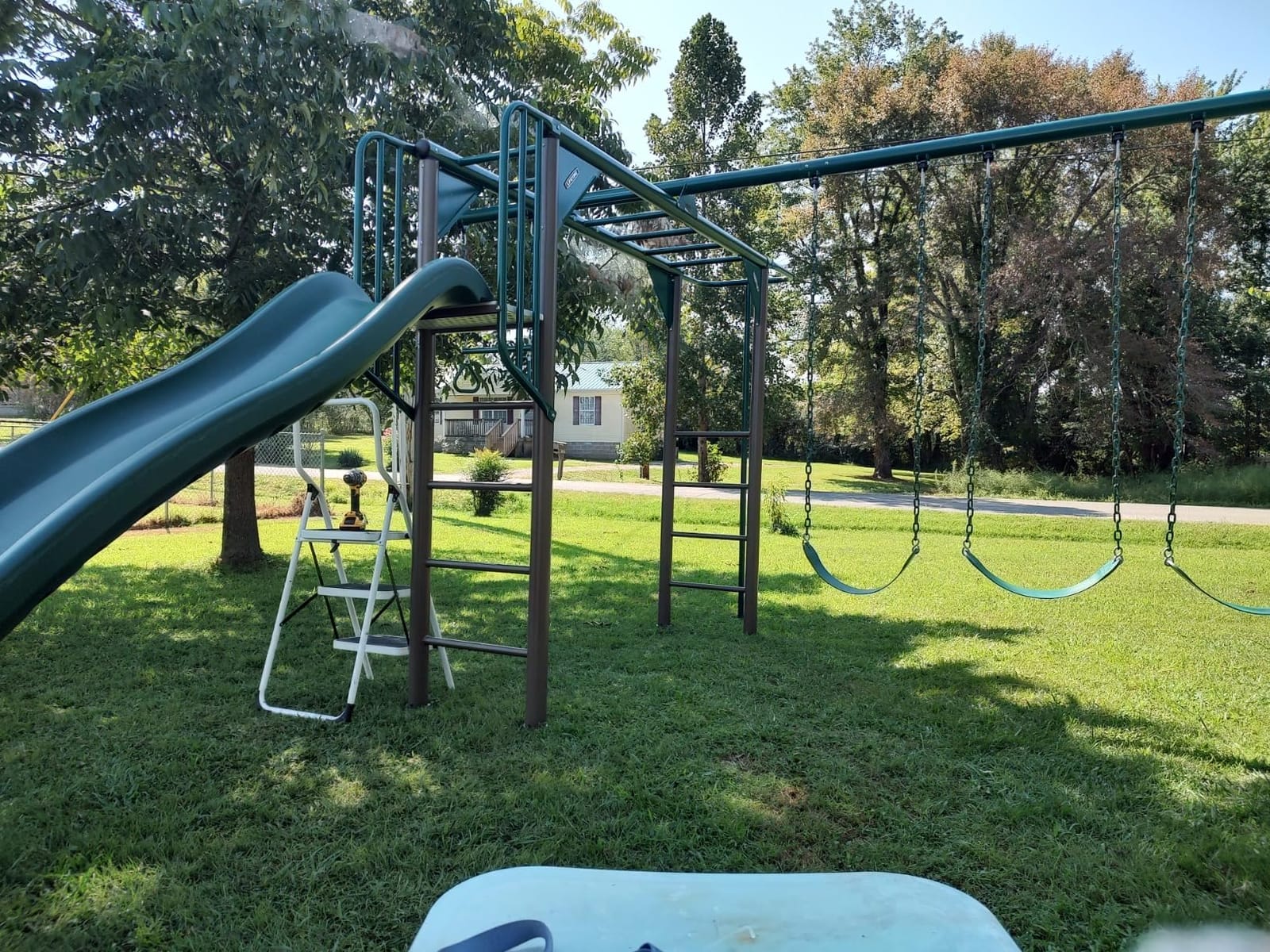 Lifetime 91028 Monkey Bar Adventure Swing Set with 3 Swings, Trapeze Bar, 9-Foot Slide and Fireman's Pole, Earthtone customer photo 1