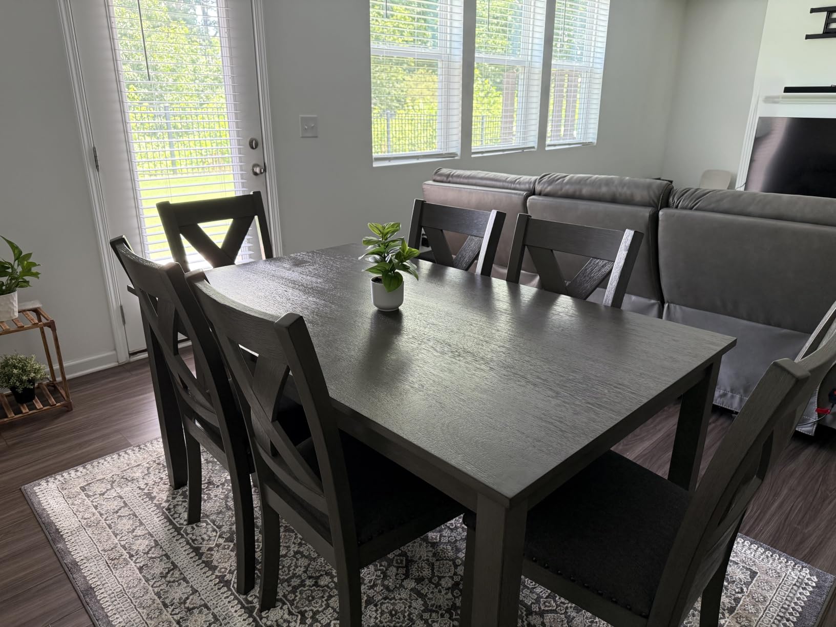 Signature Design by Ashley Rokane 7-Piece Dining Table Set for 6, Brown | Rustic rough-sawn wood veneer table, 6 easy-clean cushioned polyester chairs, Ideal for casual family dining customer photo 1