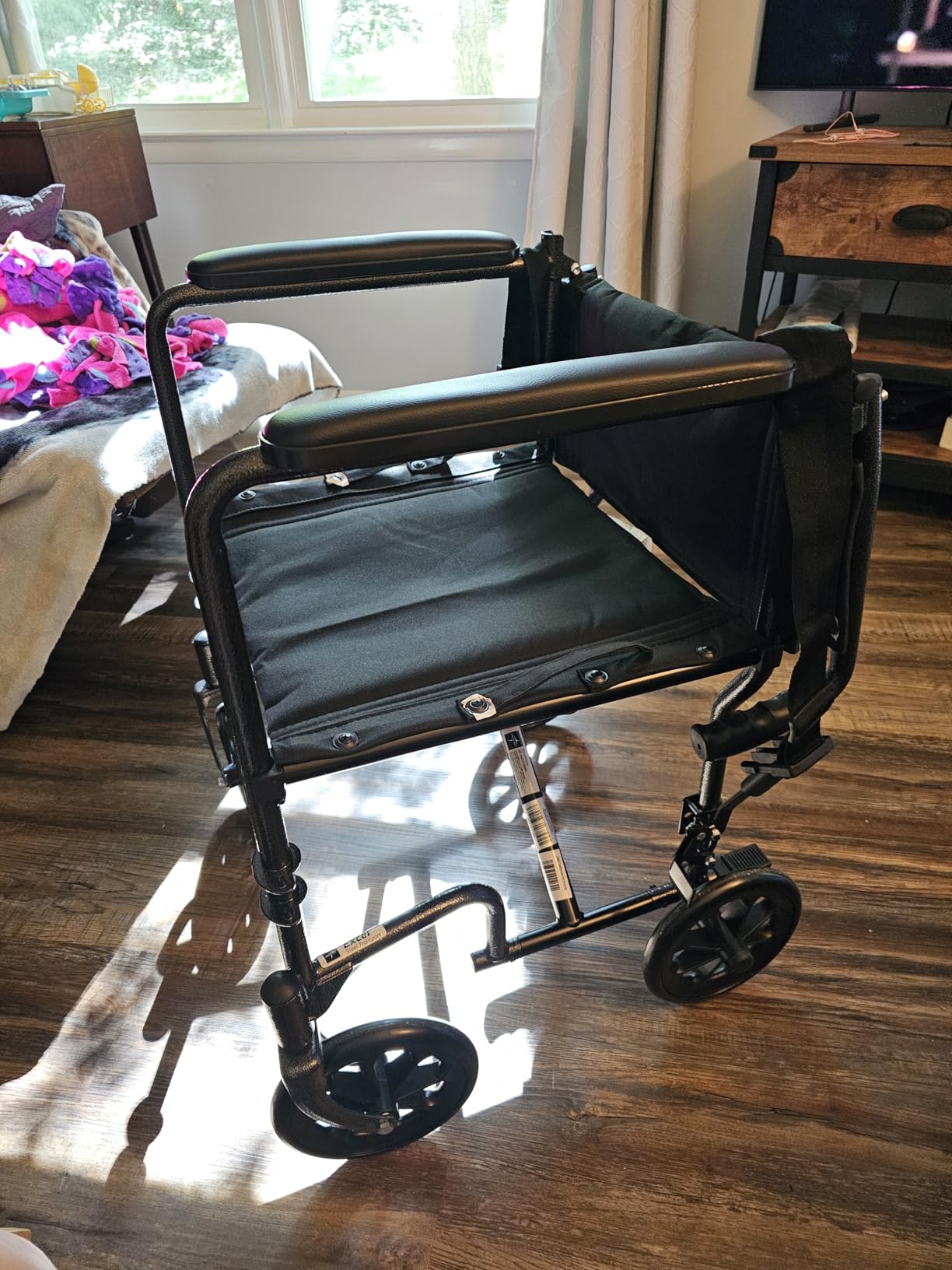 Medline Durable Folding Steel Transport Wheelchair with Swing-Away Footrests, 19-Inch Seat Width, Black Frame, Black Upholstery customer photo 2